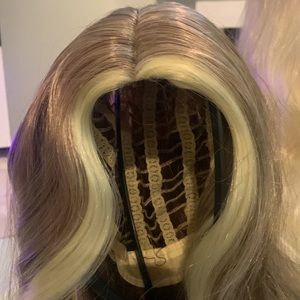 Light brown with blond highlights, long, synthetic wig.